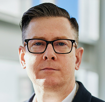 Portrait of Alexander Hughes, chief executive heading a cryptocurrency trading firm